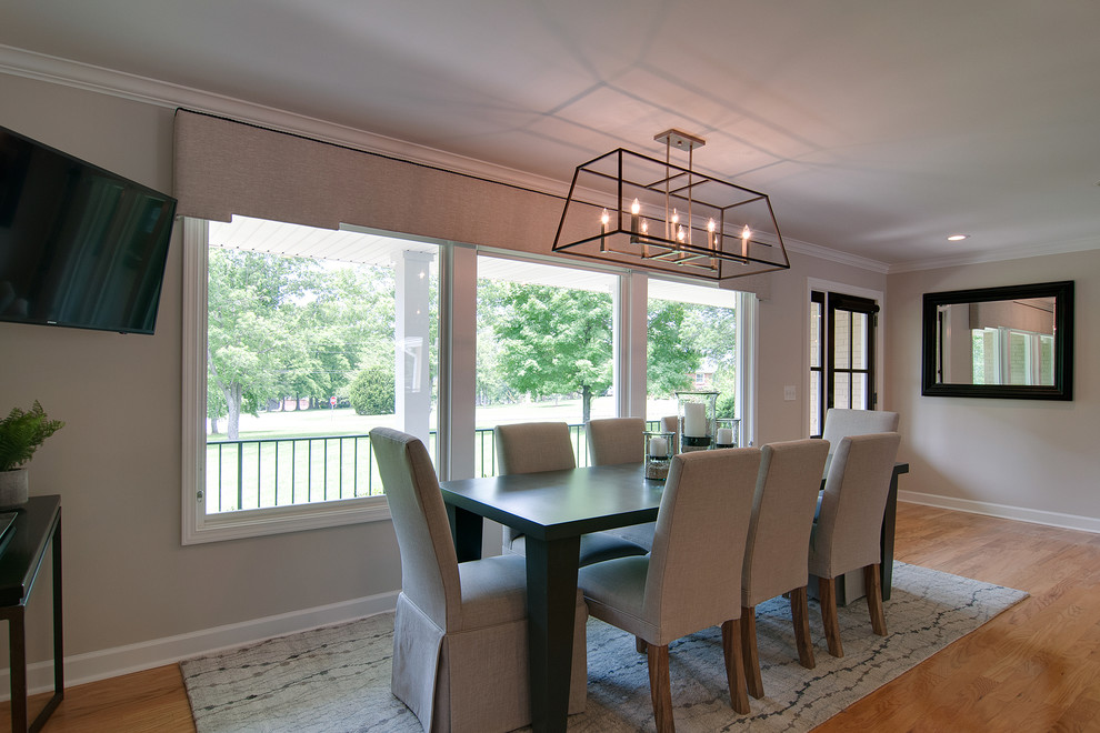 Example of a mid-sized light wood floor kitchen/dining room combo design in Nashville with gray walls