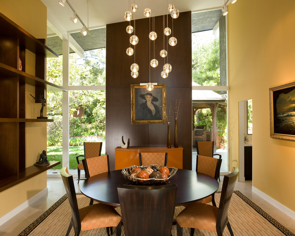 Dining room - contemporary dining room idea in Los Angeles with yellow walls