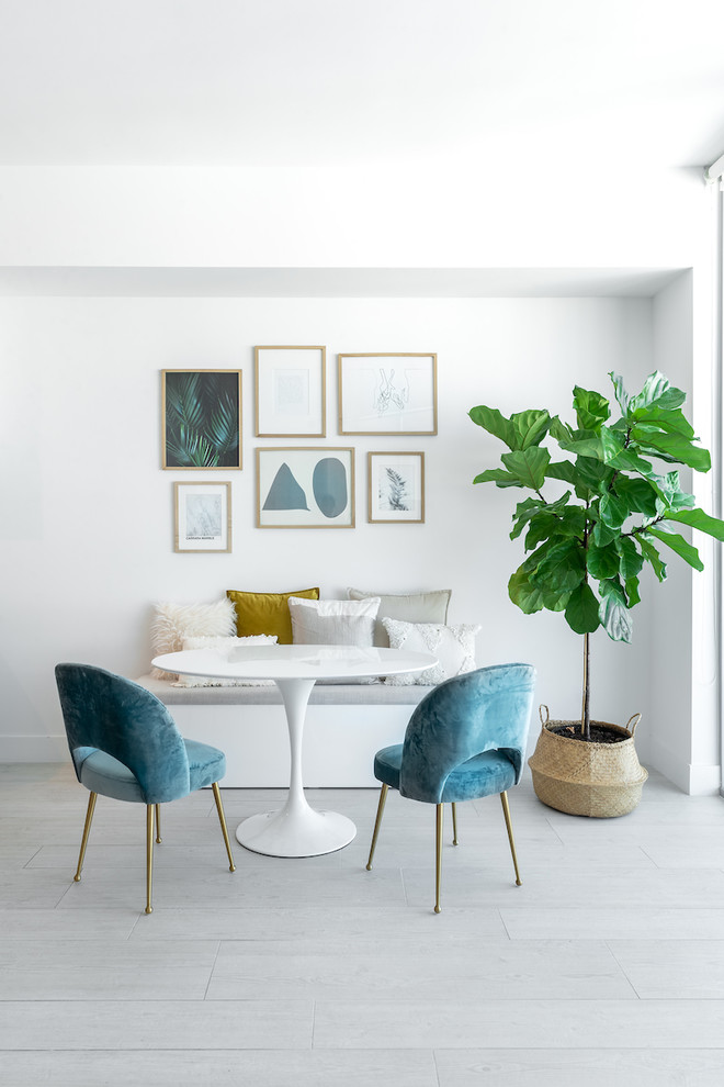 Small coastal dining room in Miami with white walls and no fireplace.