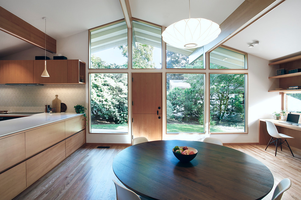 Example of a mid-sized 1960s light wood floor great room design in Seattle with brown walls