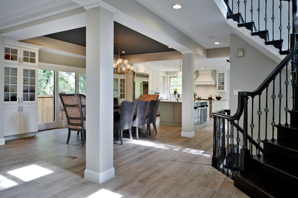 Inspiration for a large traditional kitchen/dining room in DC Metro with laminate floors and brown floors.