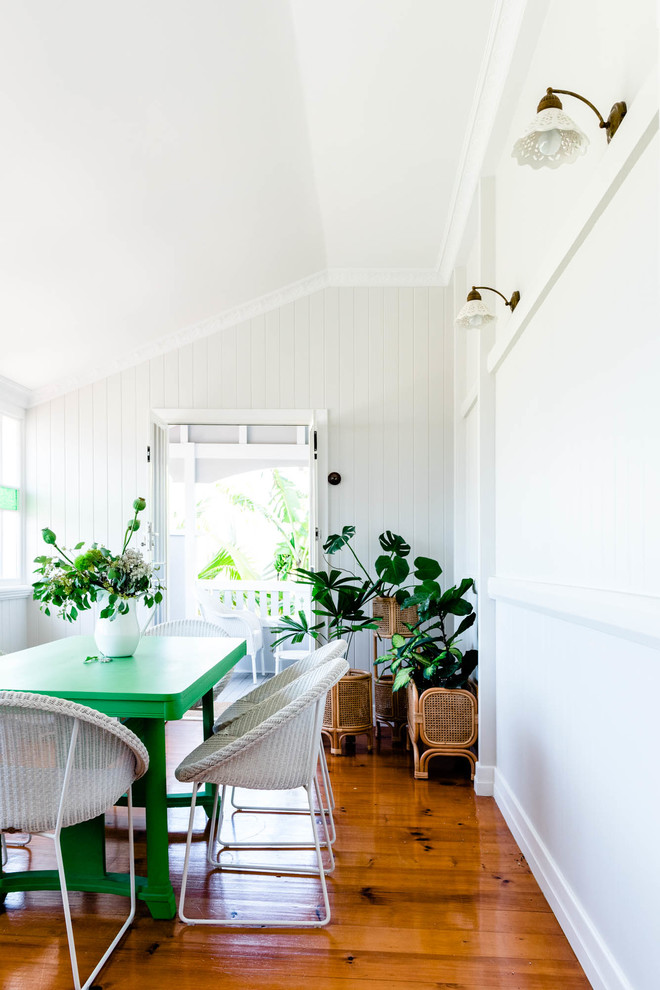 Design ideas for a medium sized scandi open plan dining room in Brisbane with white walls, light hardwood flooring and brown floors.