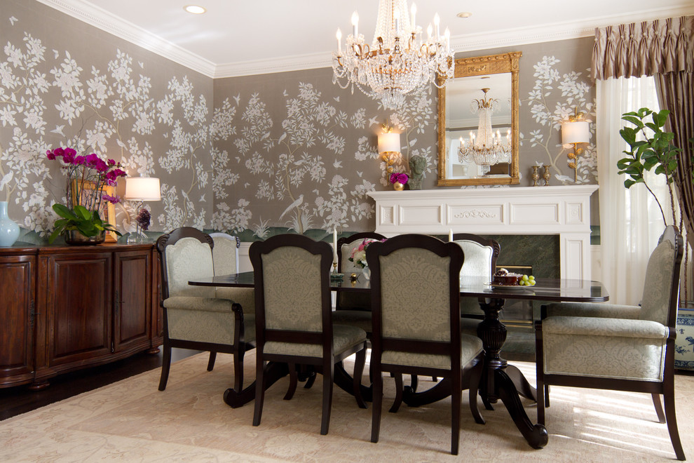 Traditional dining room in Los Angeles with dark hardwood flooring, a standard fireplace and feature lighting.
