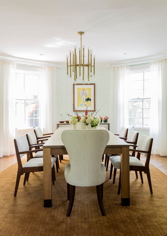 Classic dining room in Boston with green walls.
