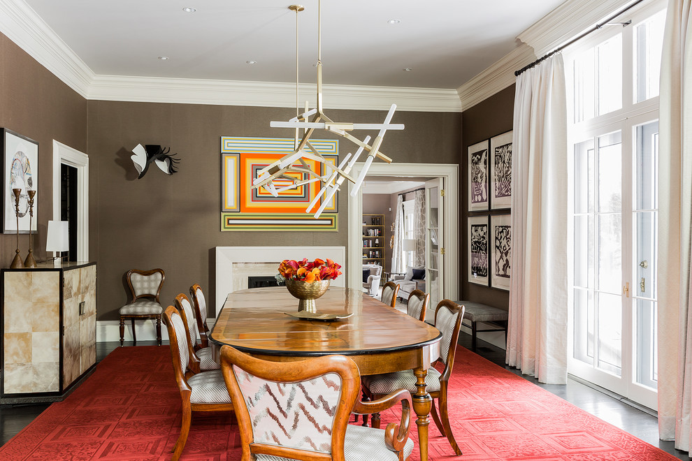 Enclosed dining room - large transitional dark wood floor enclosed dining room idea in Boston with brown walls, a standard fireplace and a stone fireplace