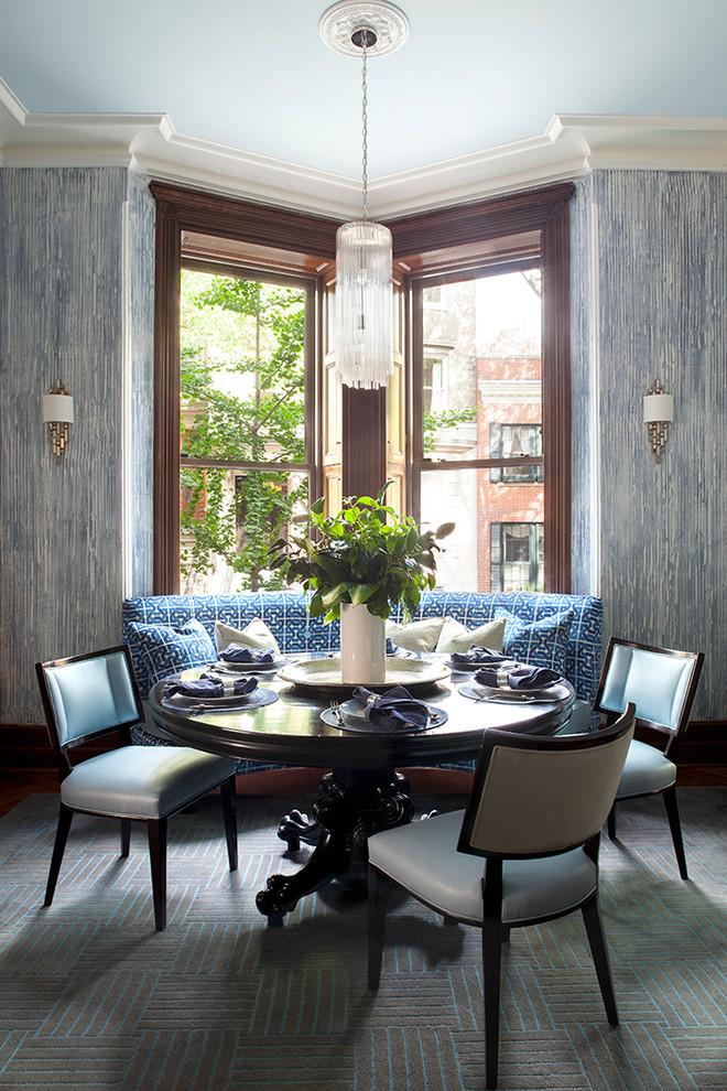 Photo of a medium sized traditional kitchen/dining room in New York with blue walls and carpet.