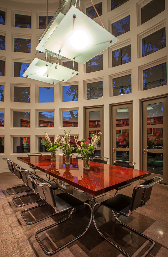 Huge trendy concrete floor enclosed dining room photo in Dallas with white walls and no fireplace