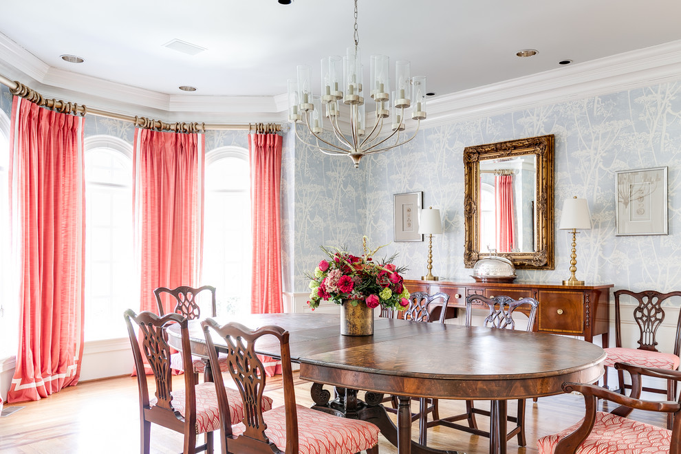 Classic enclosed dining room in Richmond with multi-coloured walls and medium hardwood flooring.