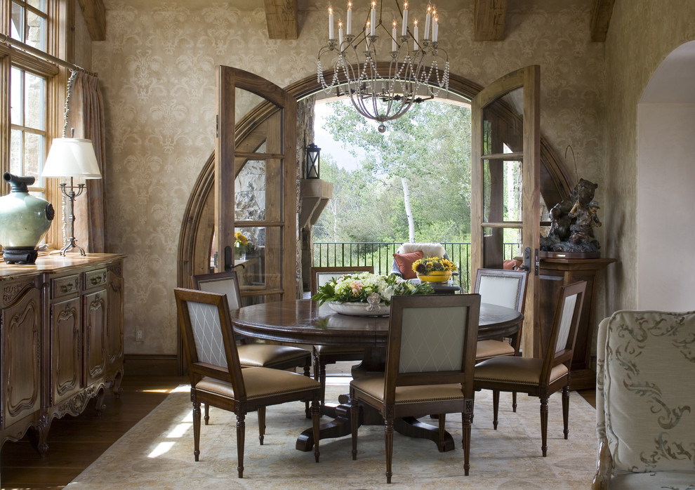 This is an example of a traditional dining room in Denver with beige walls and dark hardwood flooring.