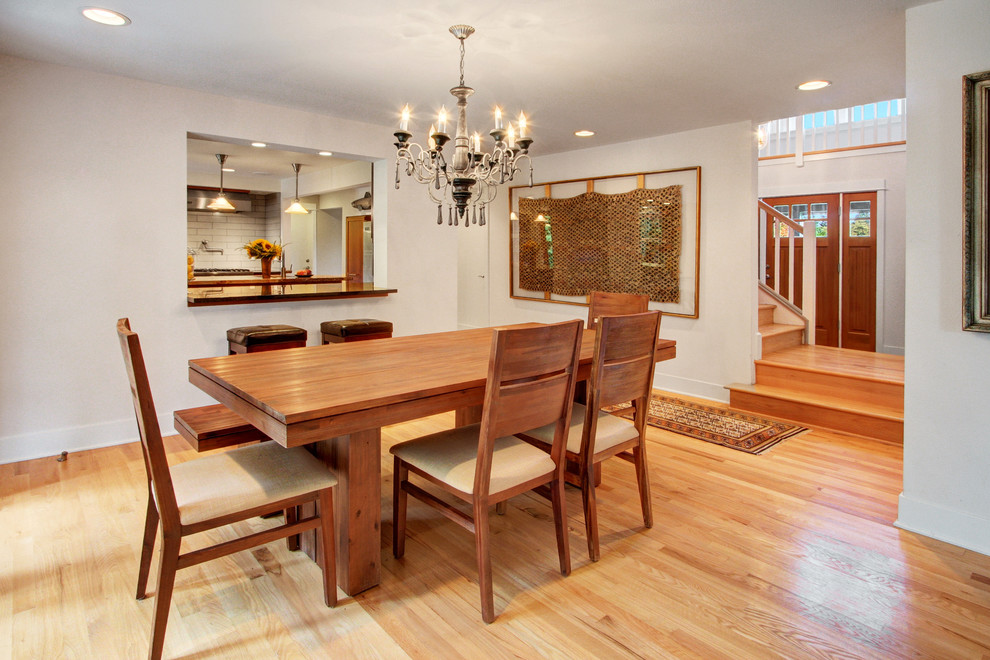 Dining room - mid-sized craftsman light wood floor dining room idea in Seattle with white walls and no fireplace