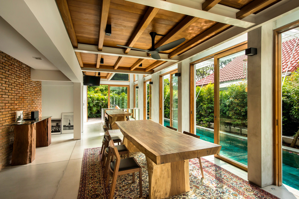 Example of an island style dining room design in Singapore