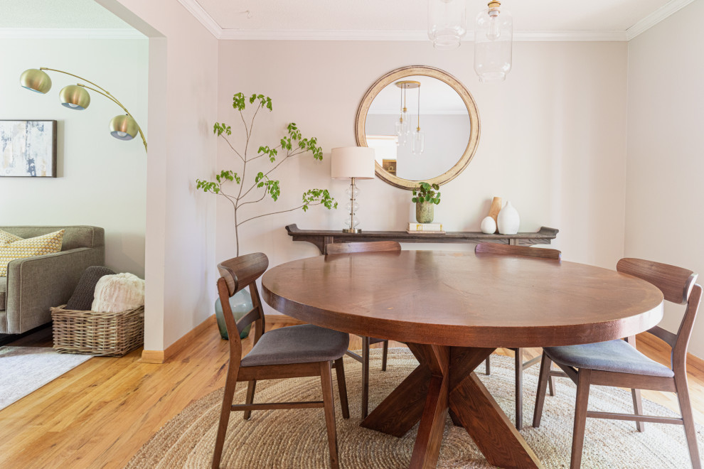 Transitional medium tone wood floor and brown floor enclosed dining room photo in Minneapolis with gray walls