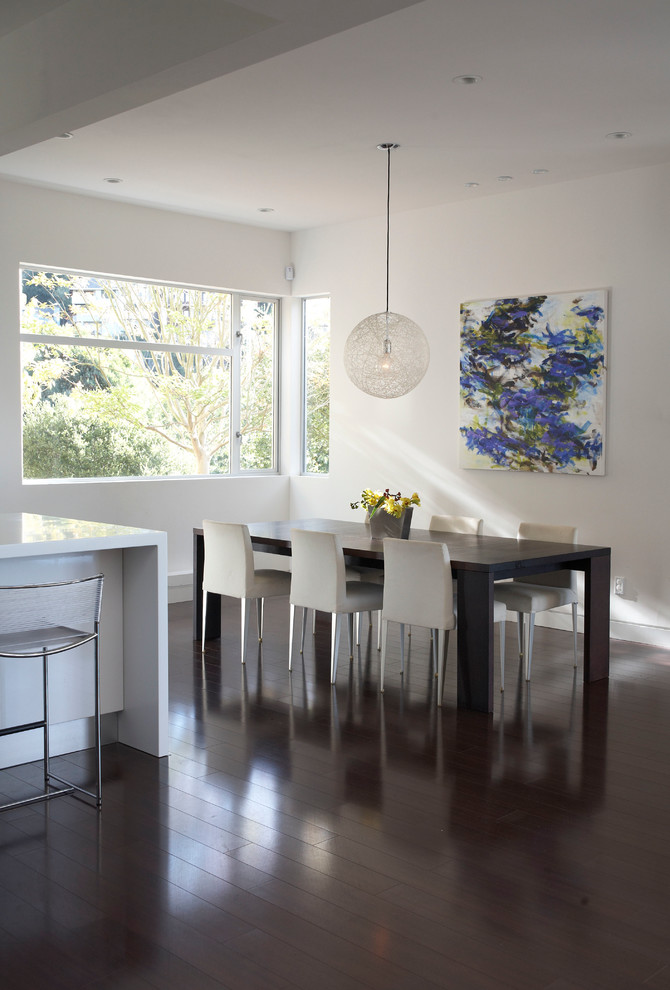 Design ideas for a medium sized contemporary dining room in San Francisco with white walls and dark hardwood flooring.