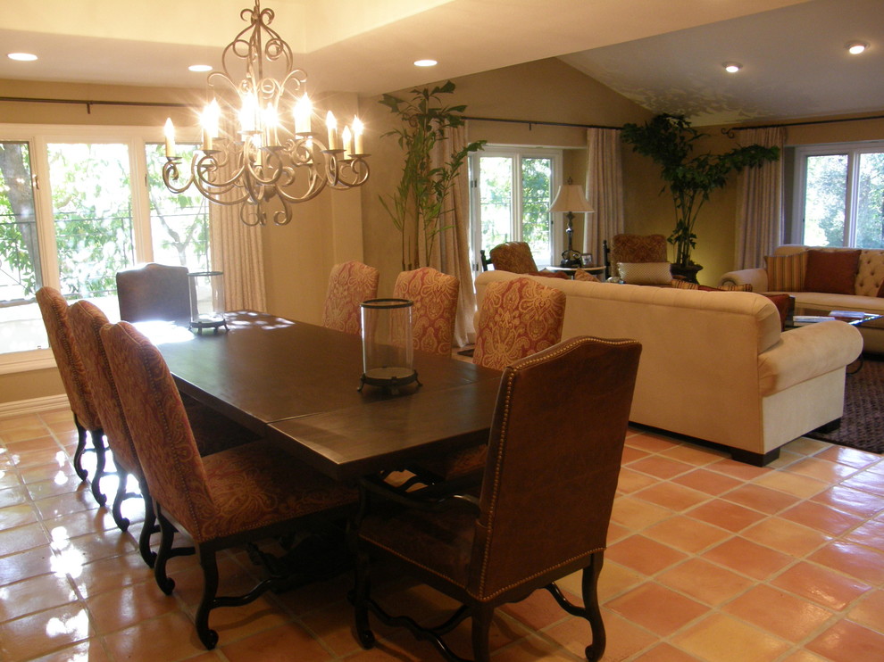 Large mediterranean open plan dining room in Los Angeles with beige walls, terracotta flooring and no fireplace.