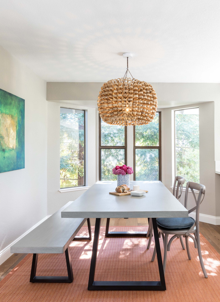 Breakfast nook - large transitional medium tone wood floor and brown floor breakfast nook idea in Sacramento with gray walls and no fireplace