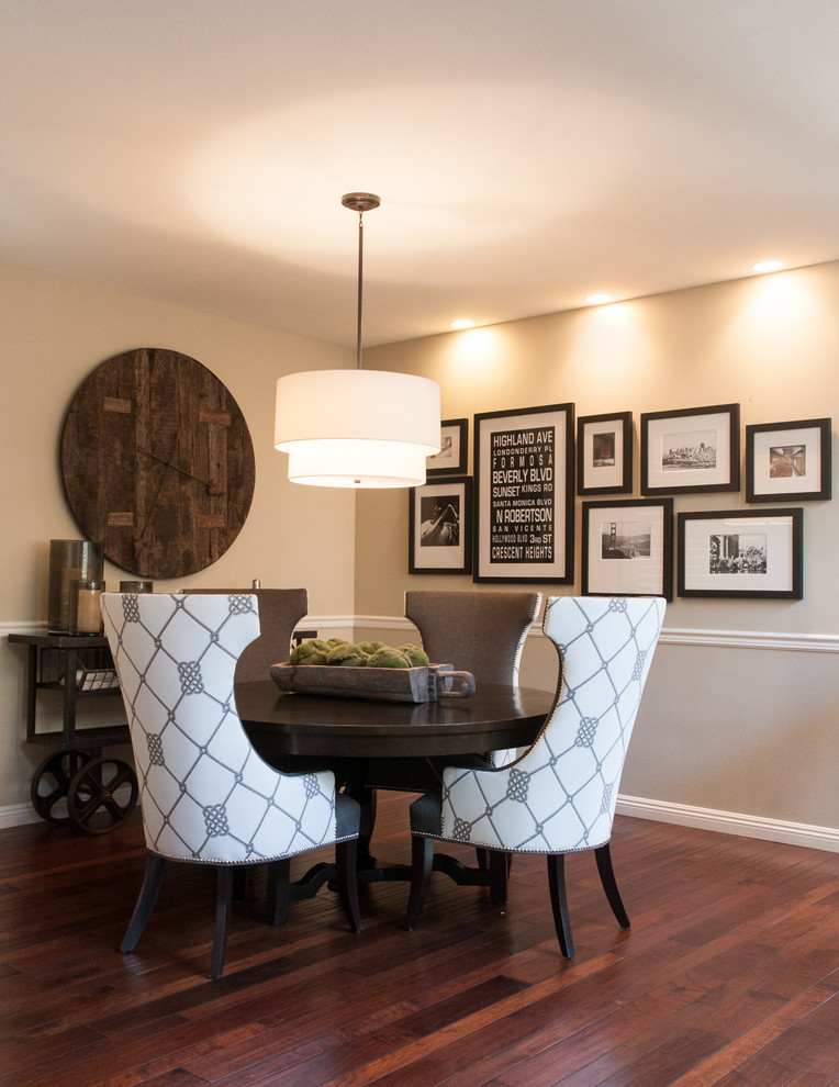 Classic dining room in Orange County with beige walls and dark hardwood flooring.