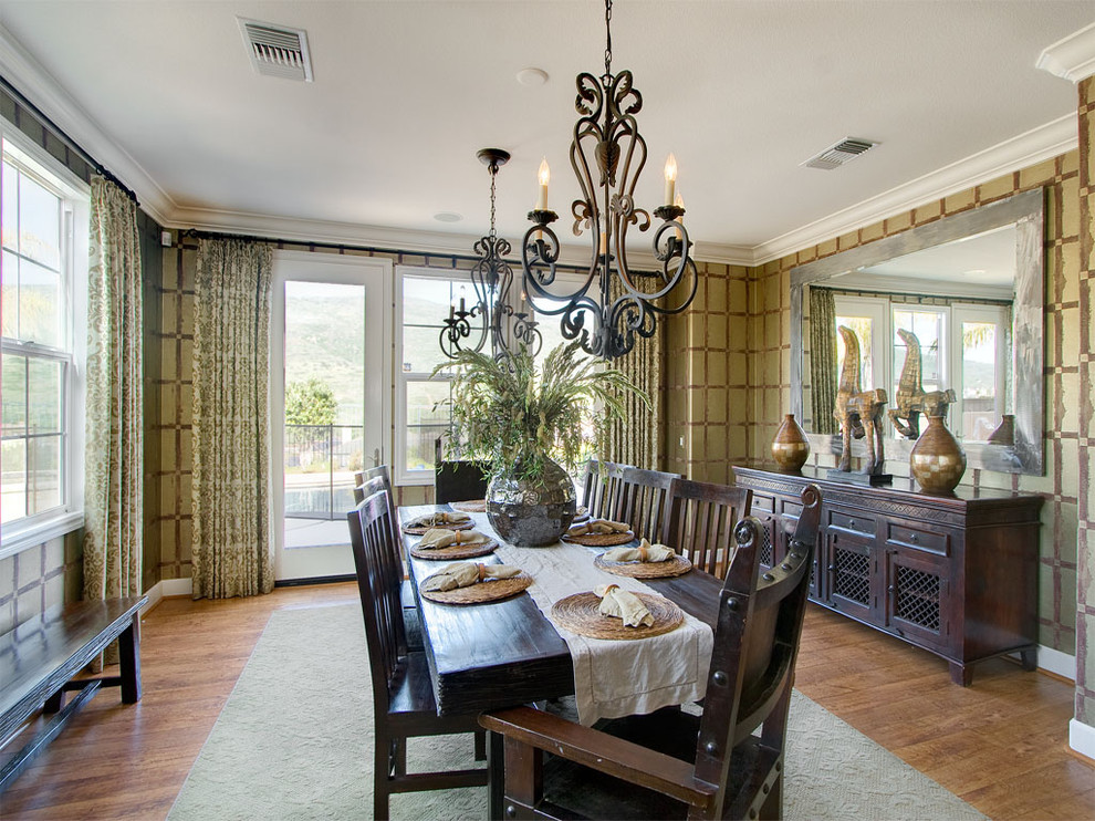 Inspiration for a contemporary enclosed dining room in San Diego with dark hardwood flooring.