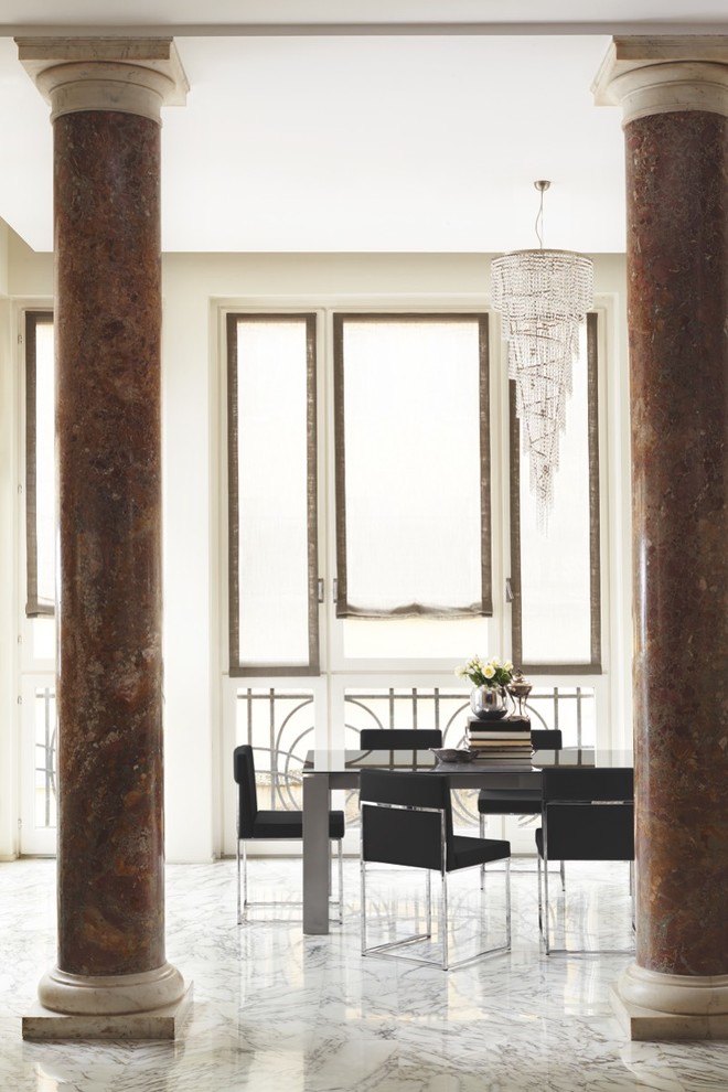 Photo of a large contemporary dining room in New York with white walls, marble flooring and no fireplace.