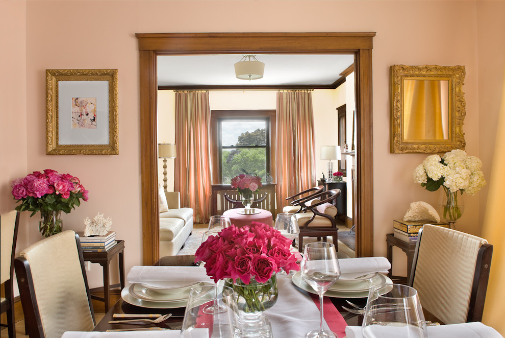 Inspiration for a timeless enclosed dining room remodel in Boston with pink walls