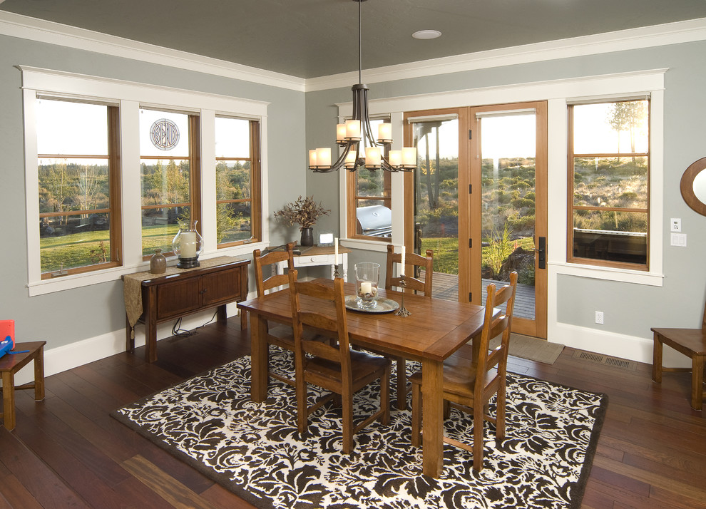 Photo of a contemporary dining room in Seattle with grey walls and dark hardwood flooring.