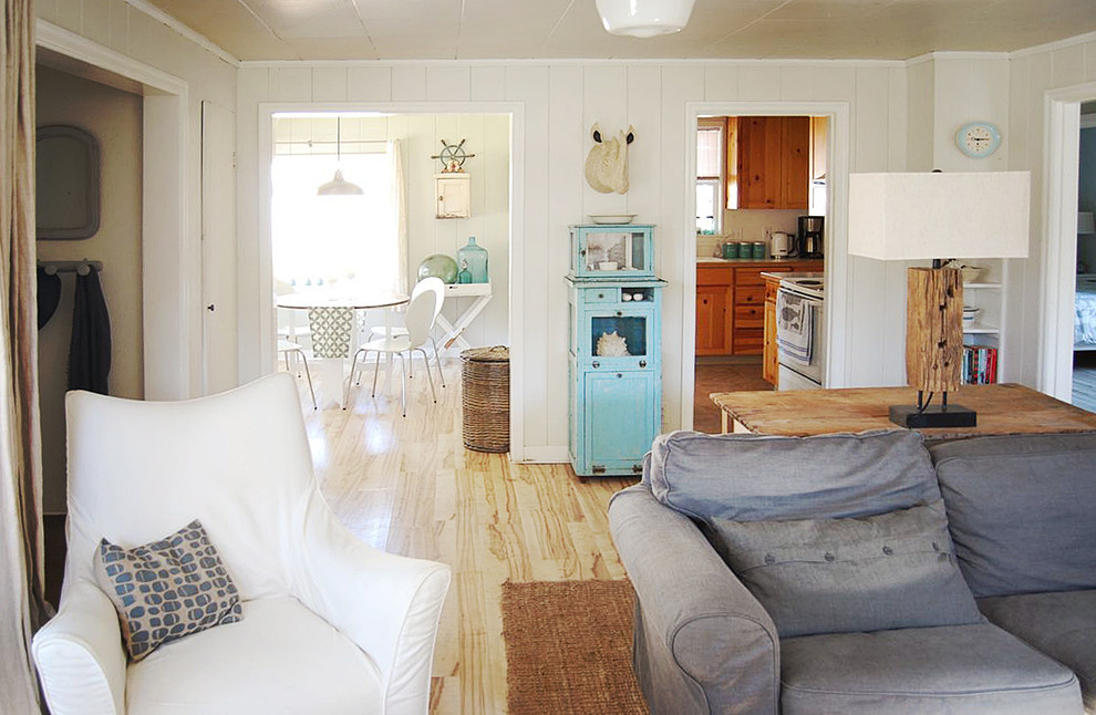 Example of a small beach style kitchen/dining room combo design in Portland with gray walls