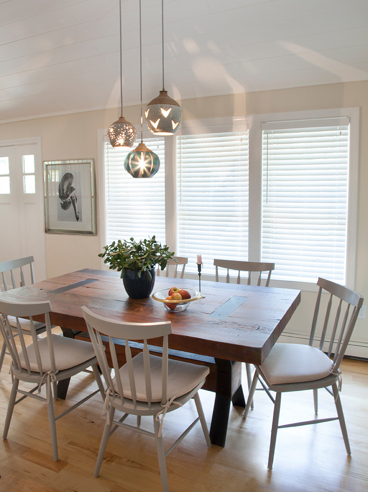 Medium sized rural open plan dining room in Boston with beige walls, light hardwood flooring and beige floors.