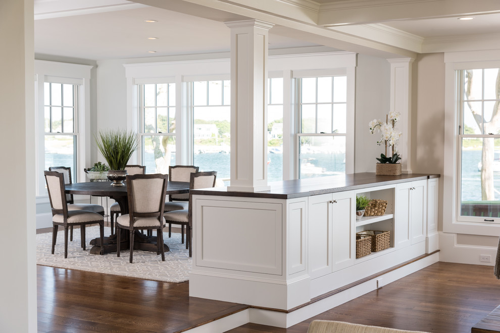 This is an example of a traditional open plan dining room in Boston with medium hardwood flooring and brown floors.