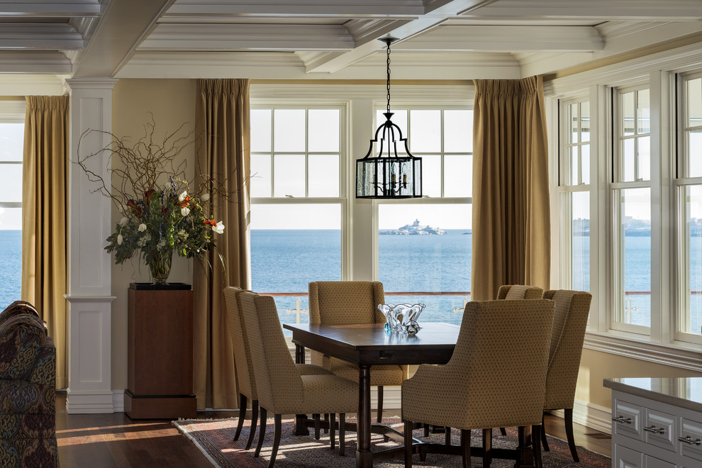 Traditional open plan dining room in Portland Maine with beige walls.