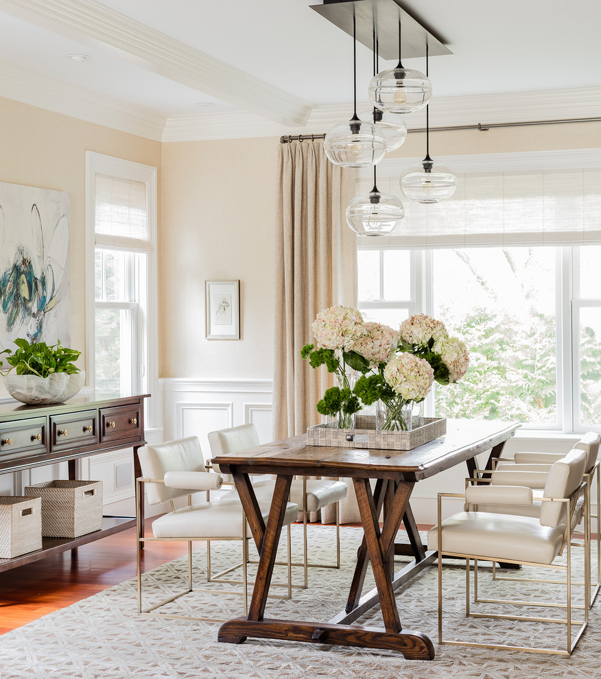 Inspiration for a large classic dining room in Boston with beige walls and medium hardwood flooring.