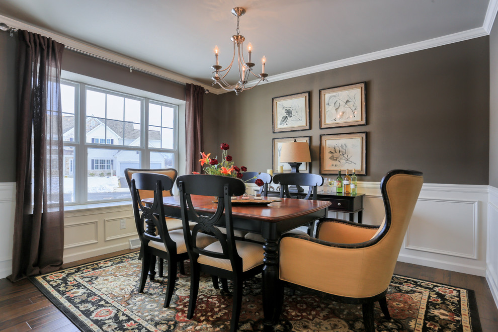 Medium sized traditional enclosed dining room in Other with grey walls, dark hardwood flooring, no fireplace and feature lighting.