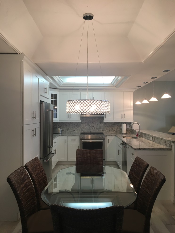Nautical kitchen/dining room in Miami with porcelain flooring.