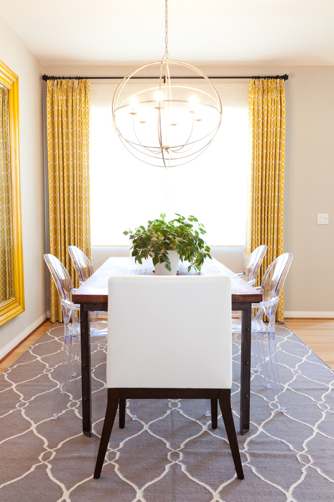 Inspiration for an eclectic medium tone wood floor dining room remodel in San Diego with beige walls