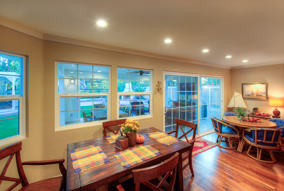 Example of a minimalist medium tone wood floor kitchen/dining room combo design in San Diego