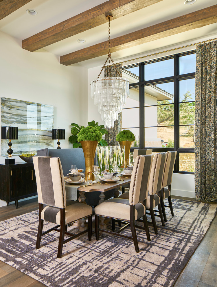 Photo of a mediterranean dining room in Other with white walls, no fireplace and dark hardwood flooring.