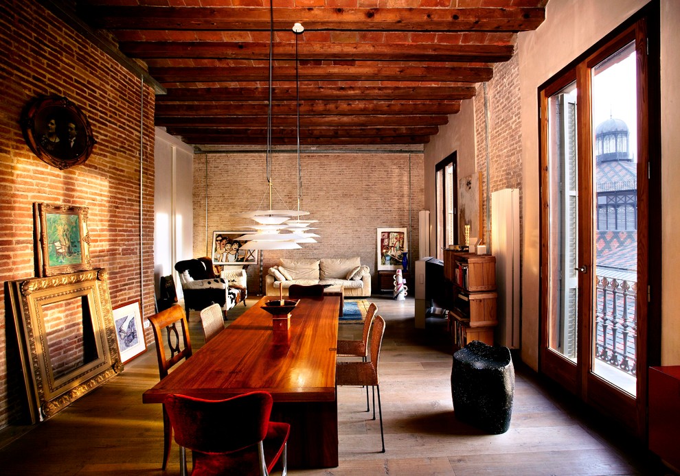 Large contemporary dining room in Barcelona with medium hardwood flooring.