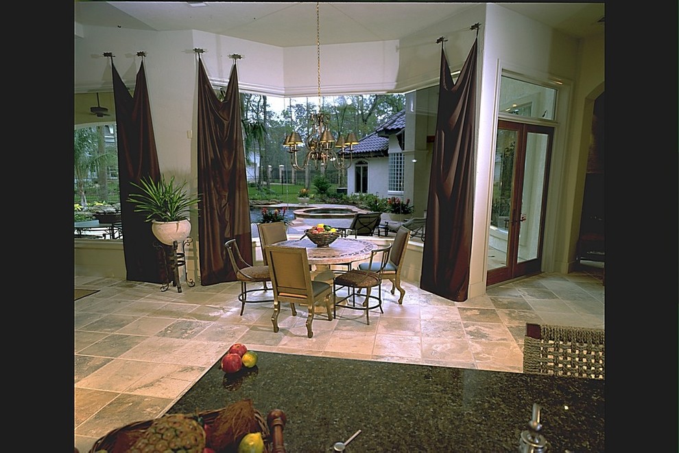 This is an example of a mediterranean dining room in Houston.