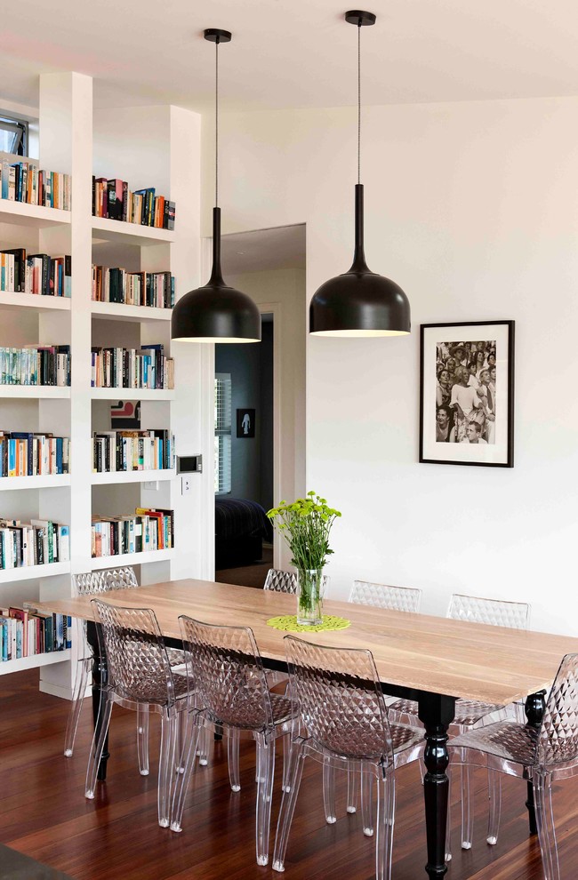 Photo of an eclectic open plan dining room in Auckland with white walls.