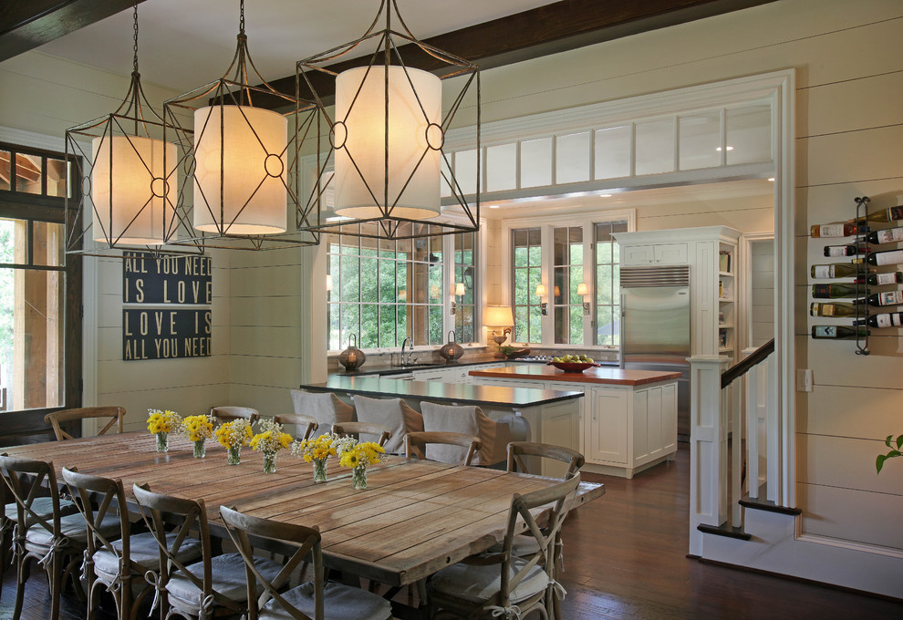 Mountain style dark wood floor and brown floor kitchen/dining room combo photo in Atlanta