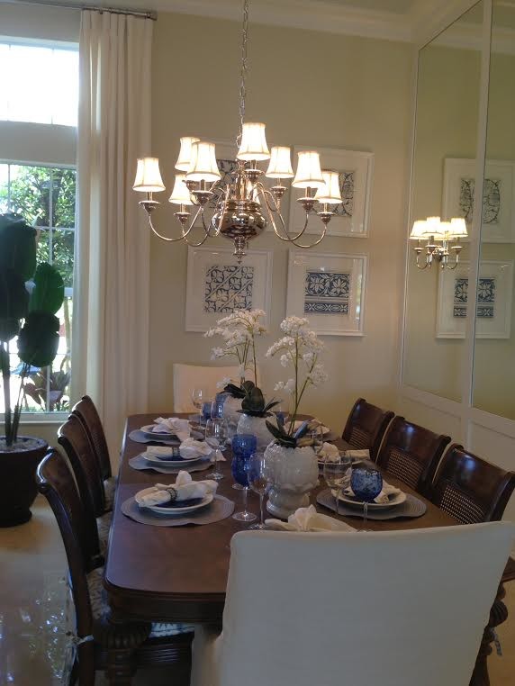 Photo of a large classic enclosed dining room in Miami with beige walls, travertine flooring and beige floors.