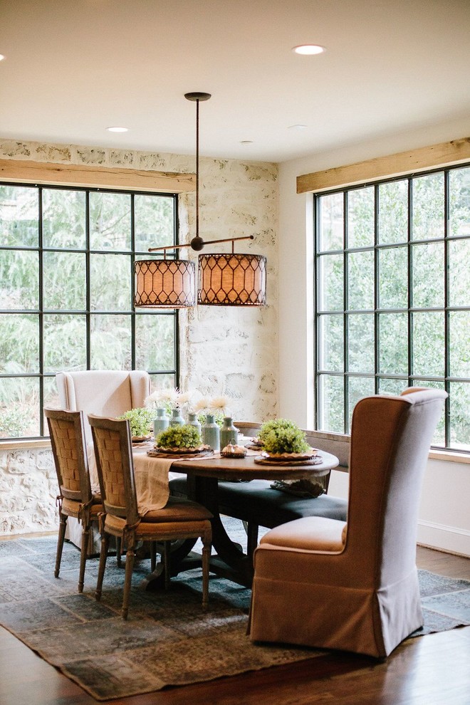 Medium sized farmhouse enclosed dining room in Atlanta with white walls and dark hardwood flooring.