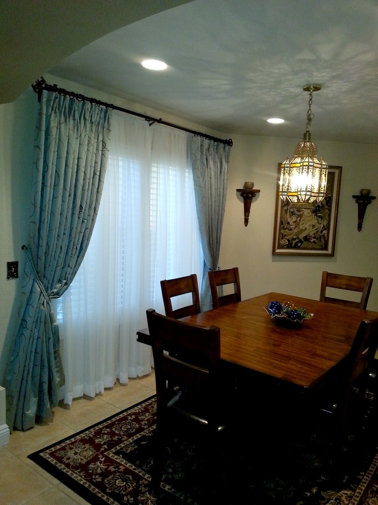Photo of a medium sized traditional enclosed dining room in Orange County with beige walls and ceramic flooring.