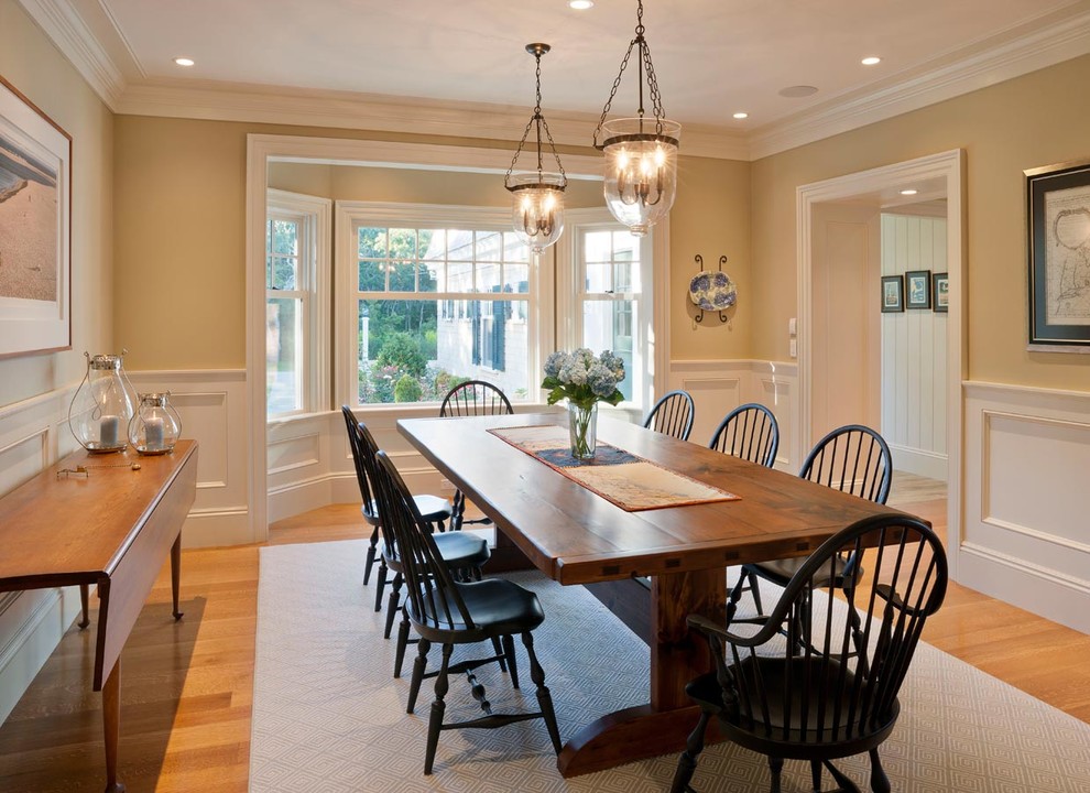 Mid-sized trendy light wood floor enclosed dining room photo in Boston with beige walls and no fireplace