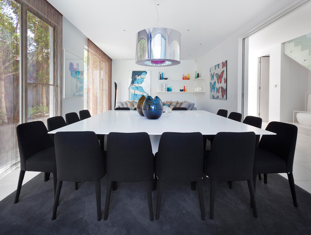 Photo of a contemporary dining room in Melbourne with white walls.