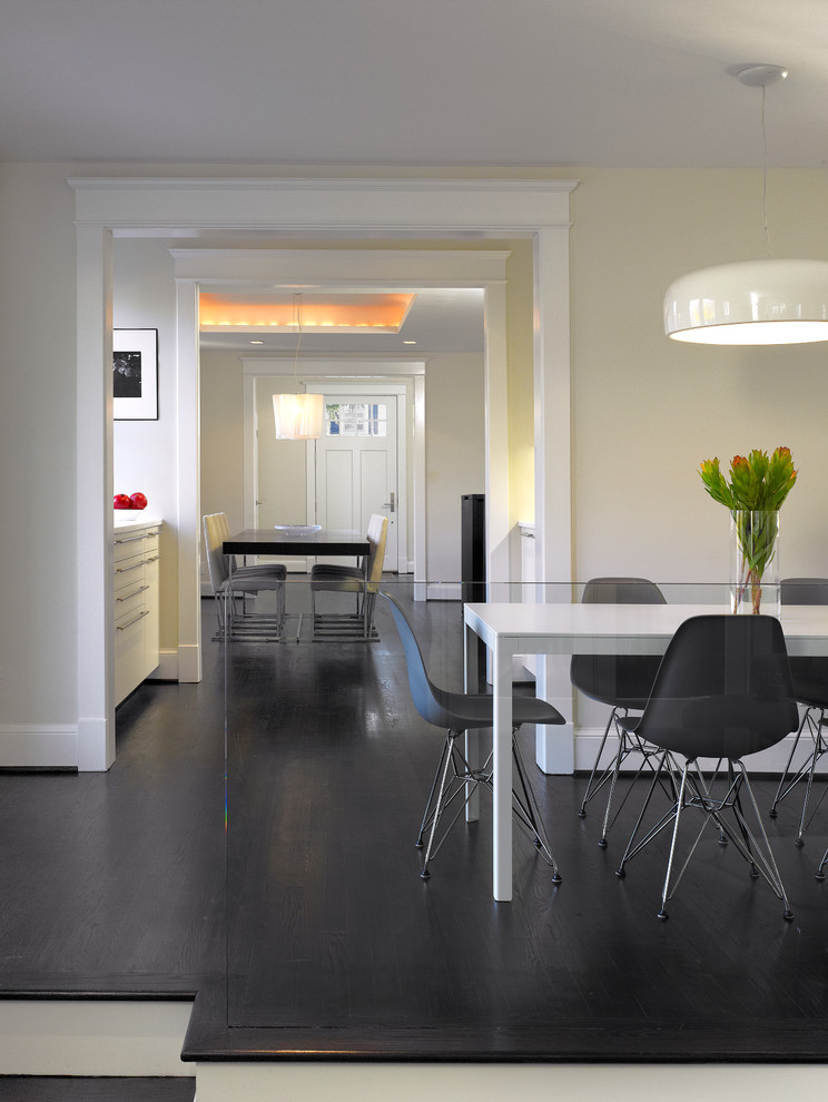 Inspiration for a contemporary dining room in DC Metro with beige walls and dark hardwood flooring.