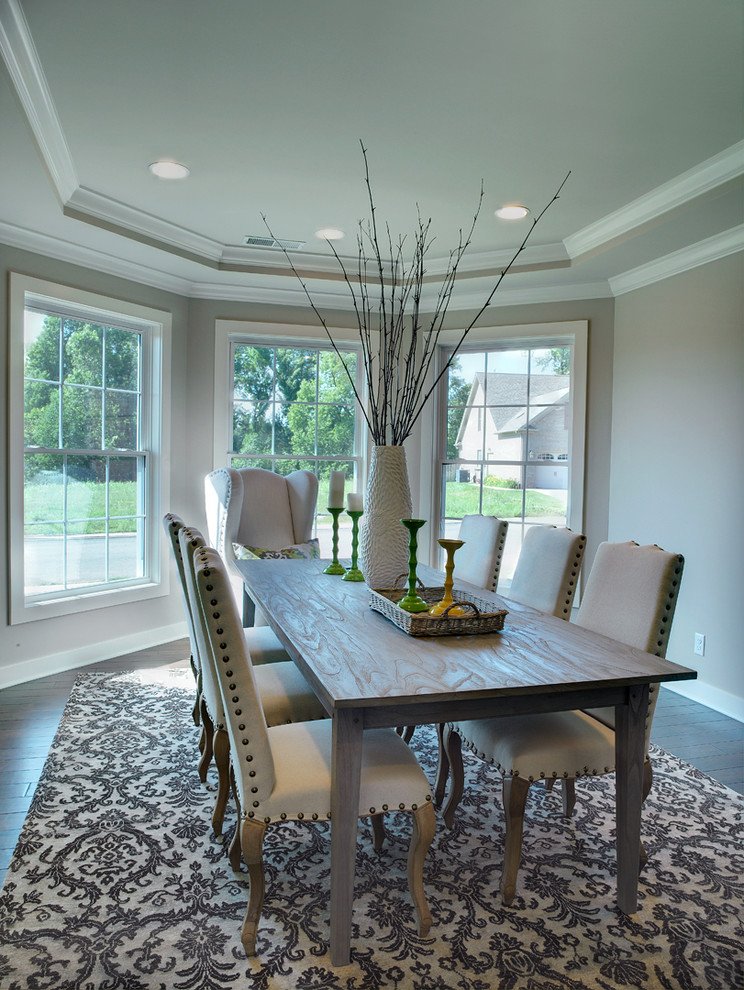 Inspiration for a mid-sized transitional enclosed dining room remodel in Other with gray walls
