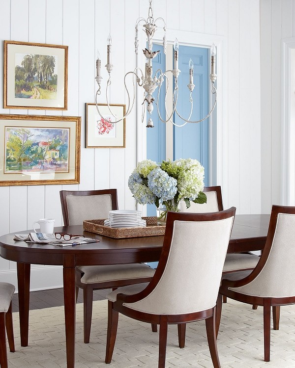 Design ideas for a medium sized coastal enclosed dining room in New York with white walls and carpet.