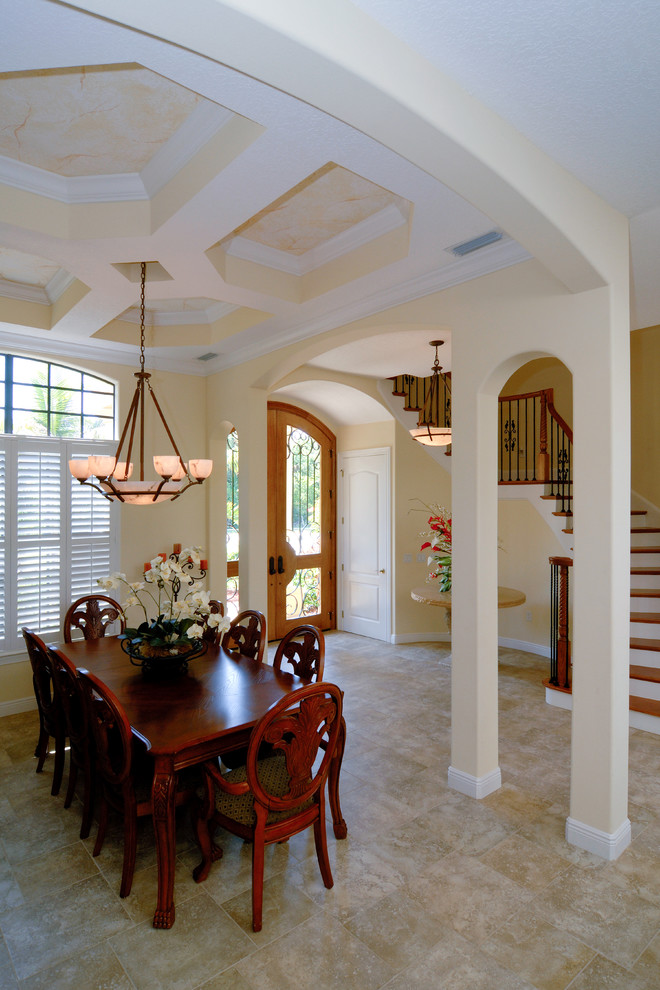 This is an example of a traditional dining room in Orlando with beige walls.