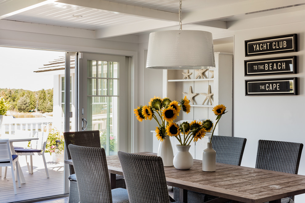 This is an example of a coastal dining room in Boston with grey walls.
