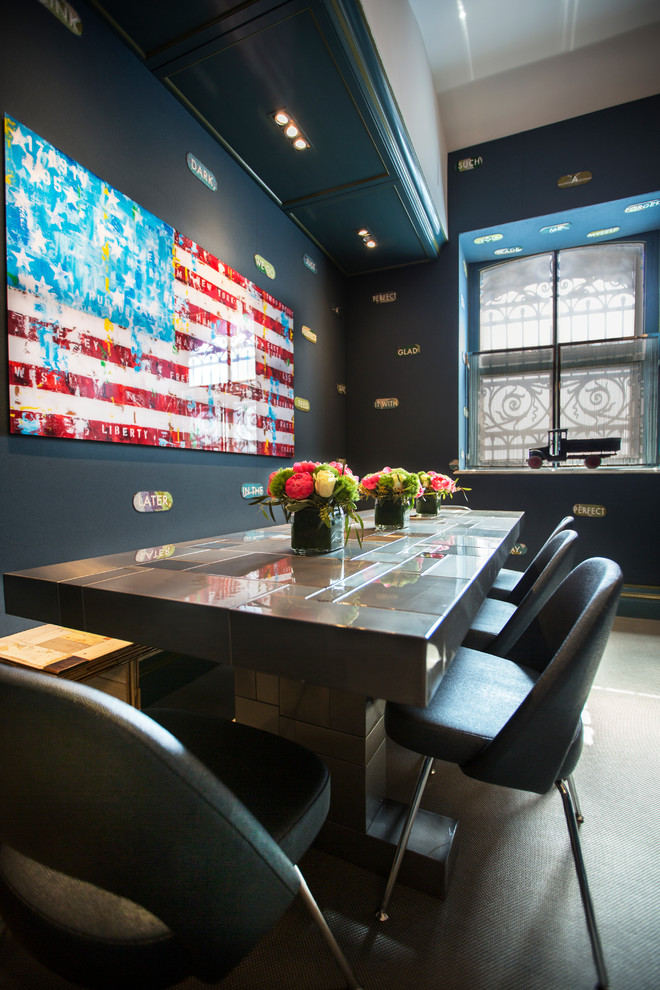 Trendy dining room photo in New York with black walls
