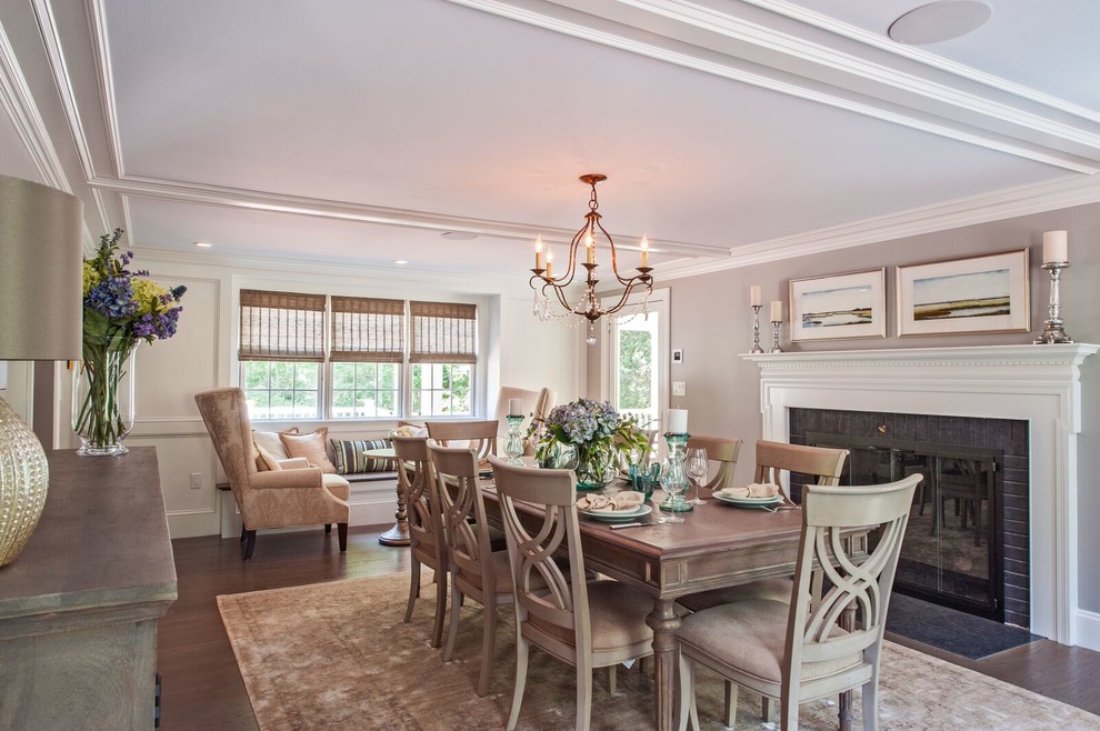Inspiration for a large transitional dark wood floor enclosed dining room remodel in Boston with beige walls, a standard fireplace and a brick fireplace